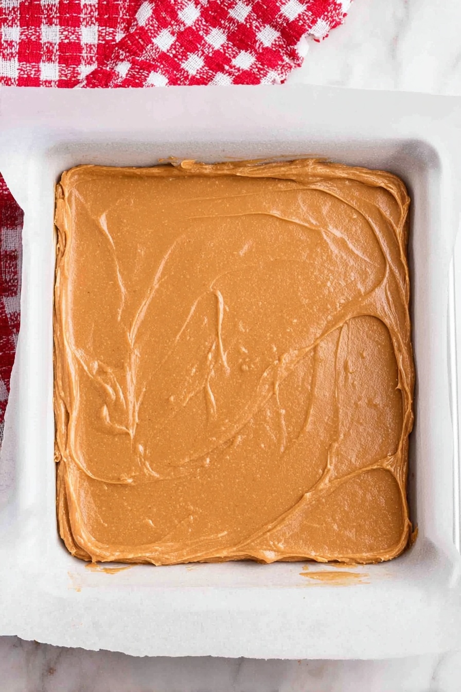 Gingerbread Blondies with White Chocolate Drizzle, holiday gingerbread blondies, festive blondie recipes, chewy gingerbread treats, white chocolate drizzle desserts - The image shows several gingerbread people and squares with a brown texture placed on a white marbled surface. The gingerbread people have white icing outlining their arms, legs, and heads, with red icing for smiles and skirts on some cookies. They also have small round icing buttons in green, pink, and red on their bodies. The square pieces have white icing drizzled diagonally and colorful round sprinkles in red, green, and pink scattered on top. In the top left corner, a red and white plaid cloth and some snowy green pine branches add a festive touch. photo taken with an iphone --ar 2:3 --v 7